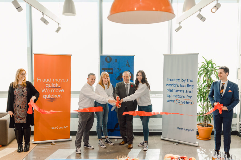 Attorney General Doug Downey joins GeoComply staff for a ribbon cutting to officially open the company's new Toronto office