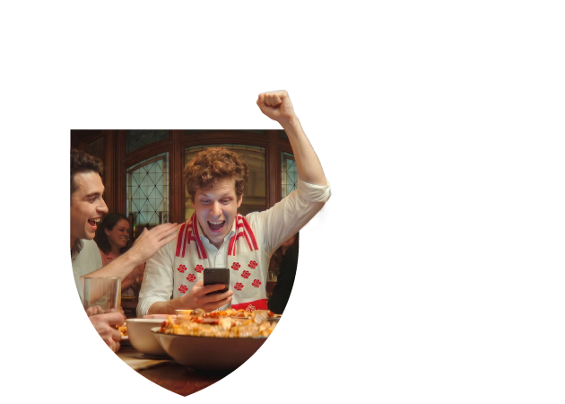 Fan holding a ticket at a venue entrance, with GeoComply's verification layer working behind the scenes